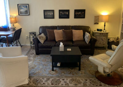 Photo of couch and art table in room 5 at TheraThrive's Lafayette office.