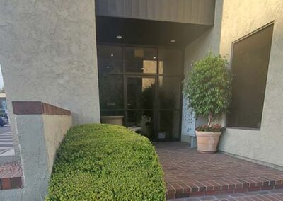 Photo of the entrance to TheraThrive's office in Toluca Lake (Burbank), CA. This picture shows that there are a few steps to the entrance. A different entrance facing W. Alameda has a wheelchair accessible entrance.